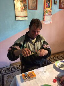 Ivica pouring me a shot of the rakija Ana and Marko had given me in Niš the day before --- although we drank about half of it that evening, when Ivica gave the bottle back to me when i was leaving next day in the morning, the bottle was somehow still full! (Serbia, April '17)