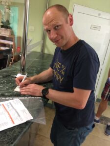 Tomasz, helping me sign in to see a doctor at the Elblag Hospital (Poland, June 18th, '17)