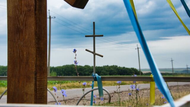 power lines --- in Ukraine, national and religious symbols are frequently bound together (Ivanivka, Mohiliv-Podils'kyi District, Vinnytsia Region, Summer '19)