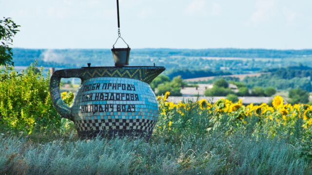 Sometimes there was also a well at the entrance of the village --- this one says, "love nature; drink healthy cold water" --- i thought the message was so cute that i was heartbroken when a couple of locals advised us against drinking from it because it's far from the village itself, and therefore not reliably monitored or maintained. (Kachkivka)